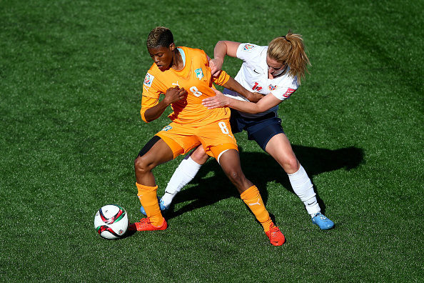 MONCTON, NB - JUNE 15:  Ingrid Schjelderup of Norway challanges Ines Nrehy of Cote D'Ivoire during the FIFA Women's World Cup 2015 Group B match between Cote D'Ivoire and Norway at Moncton Stadium on June 15, 2015 in Moncton, Canada.  (Photo by Clive Rose - FIFA/FIFA via Getty Images)